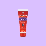 Red and white tube of Cortizone-10 intensive healing lotion for eczema on a light purple background. Describes fast relief for itchy, dry skin.