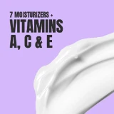 Creamy white lotion smear on a light purple background with bold black text highlighting "7 moisturizers + vitamins A, C & E."