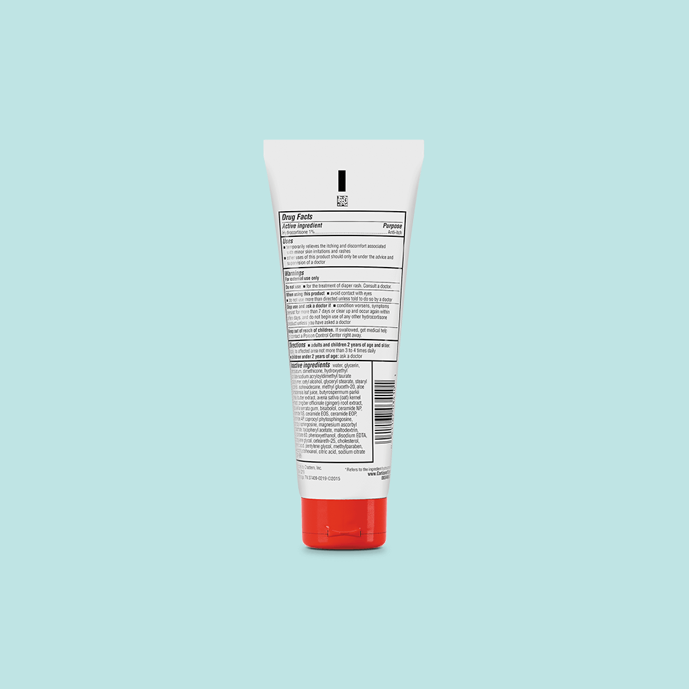 White tube with a red cap on a light blue background, displaying detailed black text on its back label, likely indicating ingredients and usage instructions.