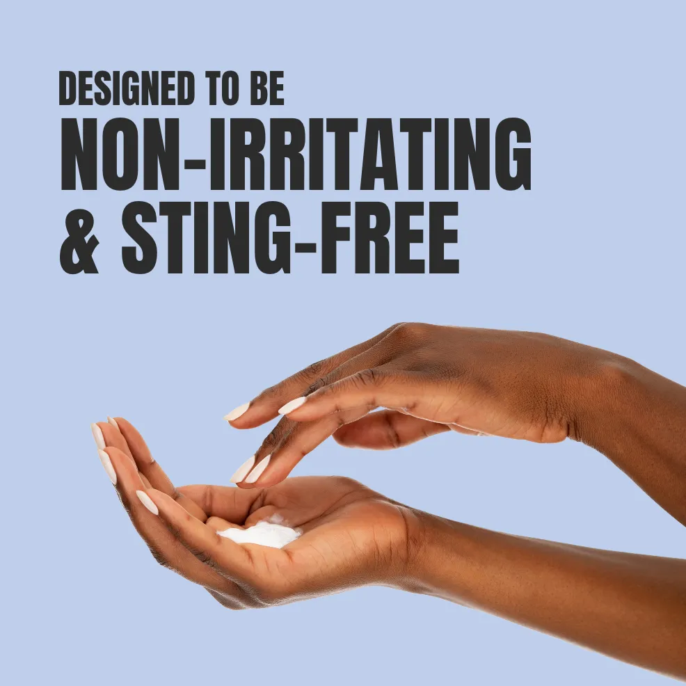 Hands with cream on one palm against a light blue background. Text reads "Designed to be non-irritating & sting-free," in bold black letters.